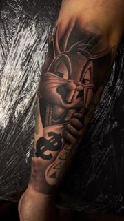 Realism cartoon rabbit tattoo by @filippidis_tattoo