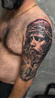 Realism jesus portrait tattoo by @filippidis_tattoo