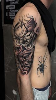 Black and grey clown faces tattoo by @filippidis_tattoo