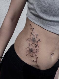 Fine line floral design tattoo by @ilias_nyxta