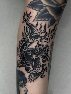 Blackwork flaming dragon tattoo by @hudsontattoo