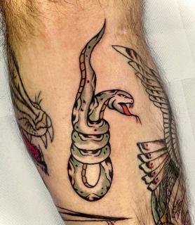 Traditional snake tattoo by @gk._tattoo