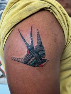 Traditional traditional swallow tattoo by @alberto_sagripanti