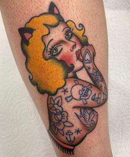 Traditional pin-up cat woman tattoo by @bratbabytattoo