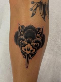 Traditional blackwork stylized monster head tattoo by @bratbabytattoo