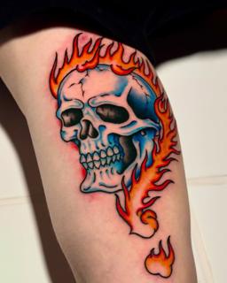 Traditional flaming skull tattoo by @_.aleek
