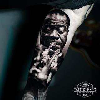 Realism musician portrait tattoo by @alx.tattooart