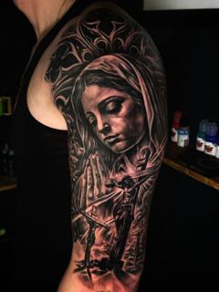 Realism religious portrait tattoo by @ao.tattoos