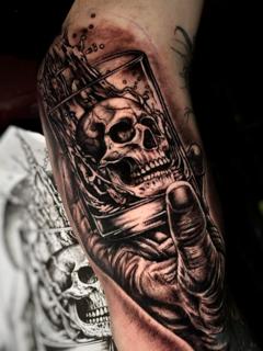 Realism skull in glass tattoo by @ao.tattoos
