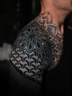 Blackwork ornamental geometric tattoo by @nero.prenta
