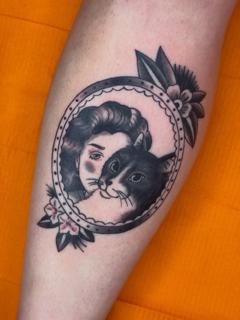 Traditional woman and cat tattoo by @aliceneedstattoos