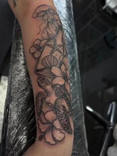 Blackwork marine life tattoo by @amberr.tattoos