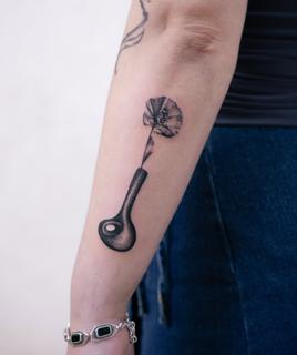 Dotwork flower in vase tattoo by @nastya.tatts