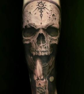 Realism skull candle tattoo by @angelaltilar_tattoo