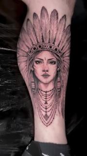 Realism feathered woman portrait tattoo by @angelaltilar_tattoo