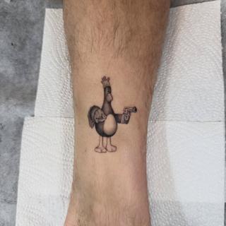 Illustrative cartoon chicken tattoo by @meerkatstattoo