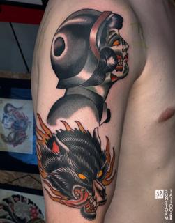 Traditional wolf and woman tattoo by @seventhswordtattoo