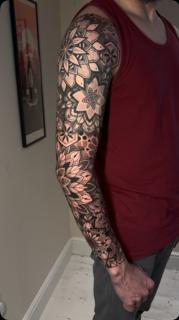 Blackwork geometric floral tattoo by @astonreynolds