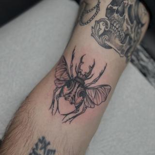 Linework beetle tattoo by @bec_tattoo