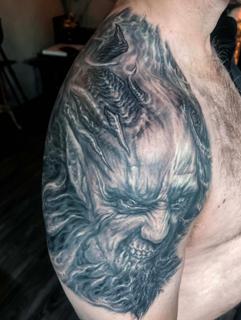 Realism demonic face tattoo by @benjaminmosstattoo