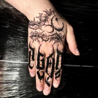 Blackwork thorny lettering tattoo by @skinnysinktattoo