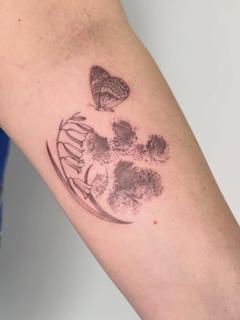 Fine line butterfly paw print tattoo by @brittbeale