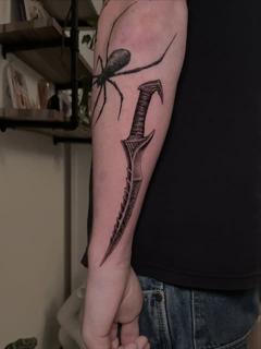 Realism spider and dagger tattoo by @dijon.did.it