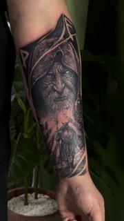Realism hooded figure tattoo by @chico_payaso.ink