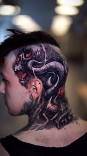 Dark realism demonic skull tattoo by @boyetattoo