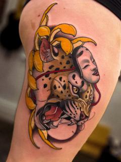 Neo-traditional leopard mask floral tattoo by @devilclawtattoo
