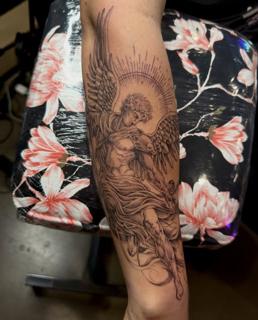 Realism angel tattoo by @jiffaloaf