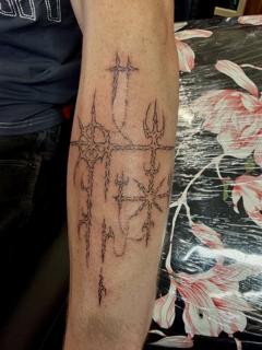 Blackwork abstract symbols tattoo by @jiffaloaf