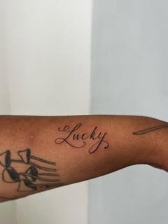 Script lucky script tattoo by @clairedaisytattoos