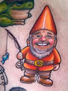 Illustrative fishing gnome portrait tattoo by @coshtattoos