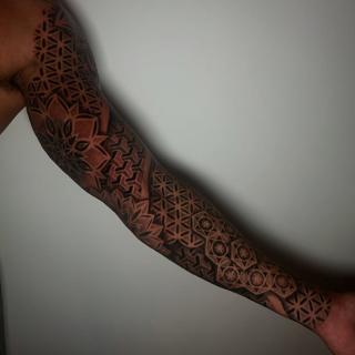 Geometric blackwork geometric patterns tattoo by @craigedentattoo