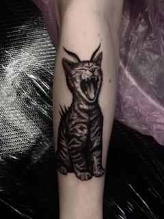 Dotwork horned cat tattoo by @freakyface_