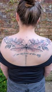 Fine line floral dragonfly tattoo by @daisy_tattooing