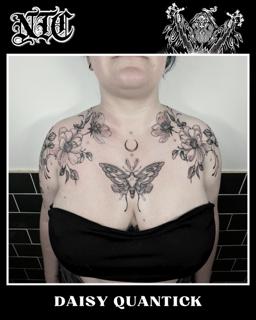Blackwork floral moth tattoo by @daisy_tattooing