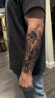 Realism portrait with gun tattoo by @mrbaldaro
