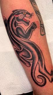 Traditional snarling panther tattoo by @derrythtattoos