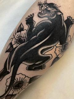 Traditional panther tattoo by @theblackrabbit_tattoostudio