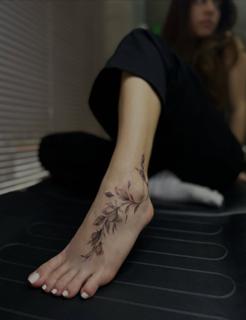 Fine line botanical floral branch tattoo by @dimel_tattooer