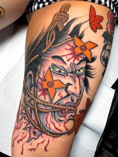 Neo-traditional bound warrior face tattoo by @dimitris_v_tattooer