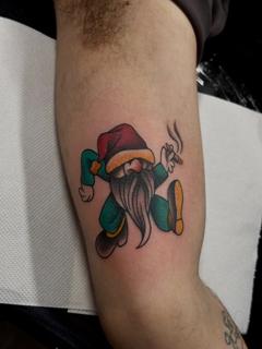 Traditional smoking gnome tattoo by @fitz.ttt