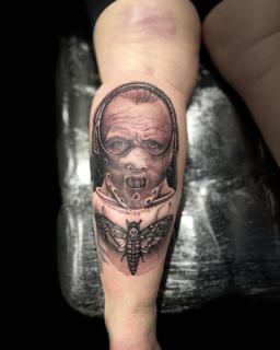 Realism masked character tattoo by @divineeyetattoo