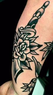 Traditional dagger and rose tattoo by @edstaplestattooer
