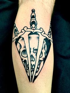 Traditional dagger skull tattoo by @edstaplestattooer