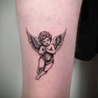Realism cherub angel tattoo by @studiotwo23