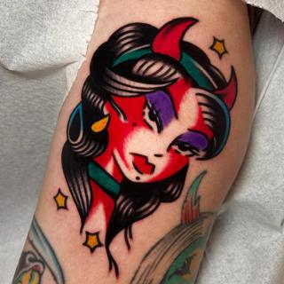 Traditional devil woman tattoo by @ellie_tattooer