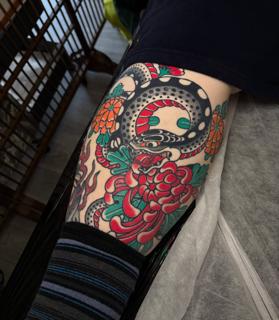 Japanese snake and flowers tattoo by @ewilliamstattoos